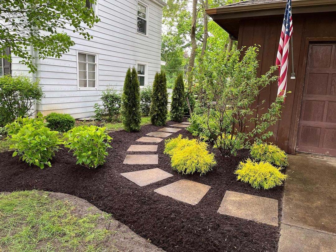 Paved walkway through a garden