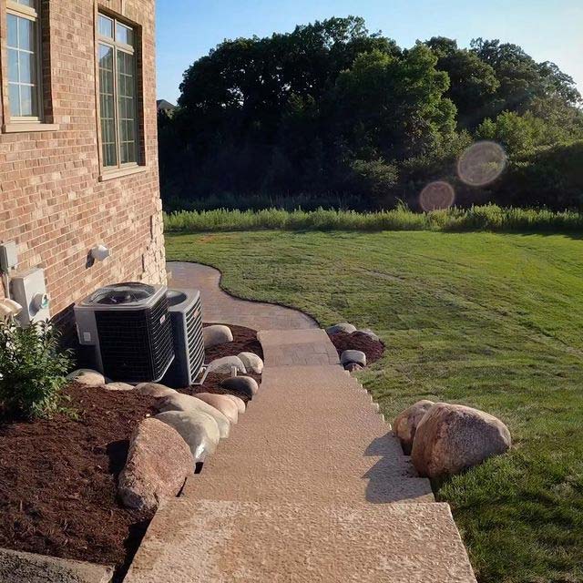 Concrete steps around a house