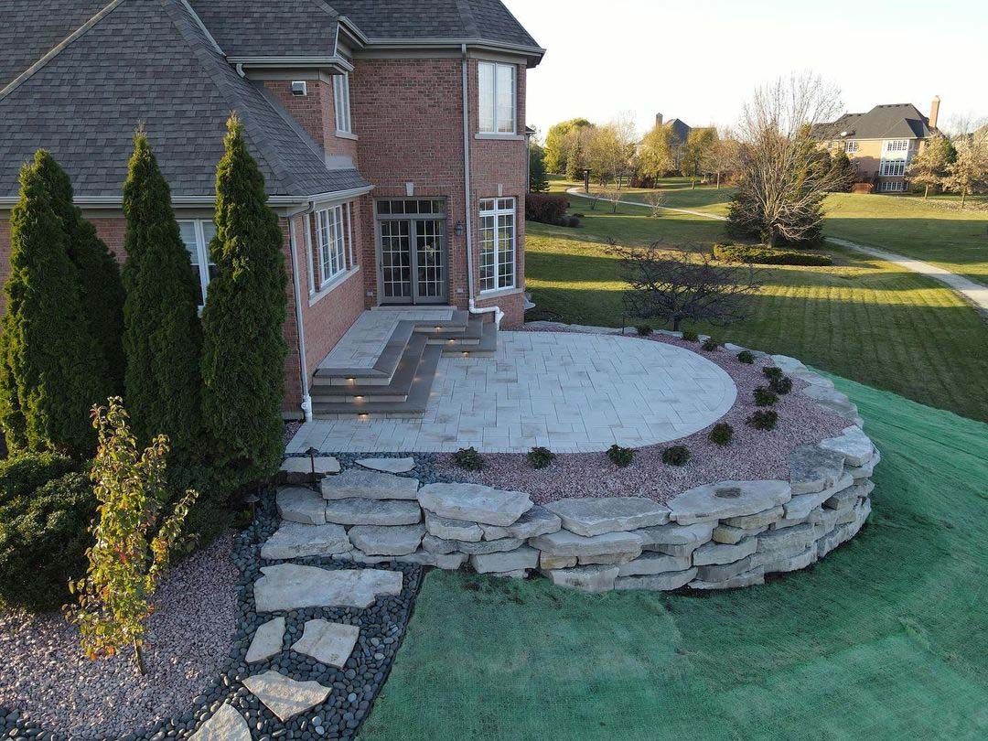 Paved patio looking out on large backyard